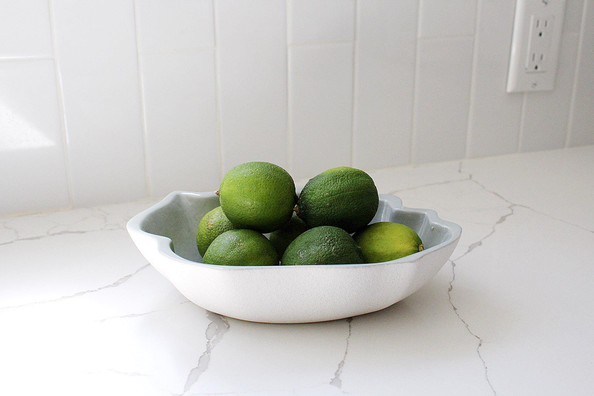 Coastal Kitchen Bowl White Stoneware Cerulean Interior Clamshell Design Modern Home Accent Piece Elegant Serving Dish Floral Arrangement Display Contemporary Dining Collection Matte Finish Decorative Shell Pattern Beach House Style